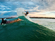     Mick kicking three fins
            to the wind